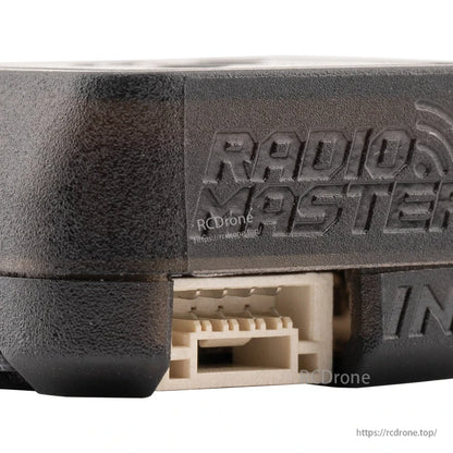 Close-up of connector port with embossed RadioMaster logo on ERS GPS casing