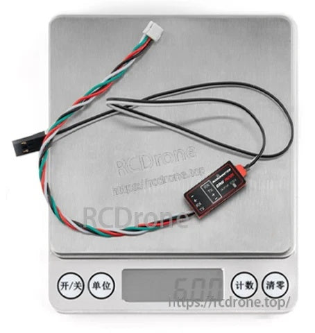 RadioMaster ERS-RC01 sensor and cable on a digital scale showing lightweight hardware