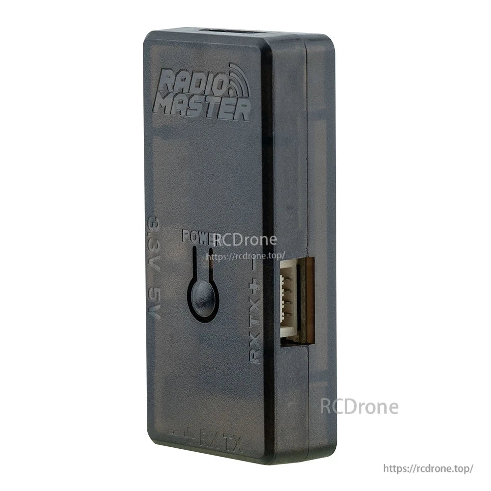 Angled view of RadioMaster ELRS USB UART flasher V2 showing side RX/TX header opening and POWER button