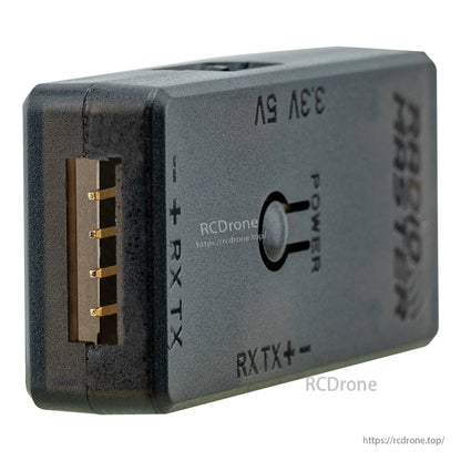 Close-up of RX/TX pin header side with +, RX, TX markings and 3.3V/5V selector label