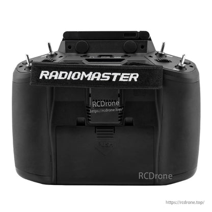 RadioMaster GX12 rear view showing battery compartment door and RadioMaster neck strap attachment