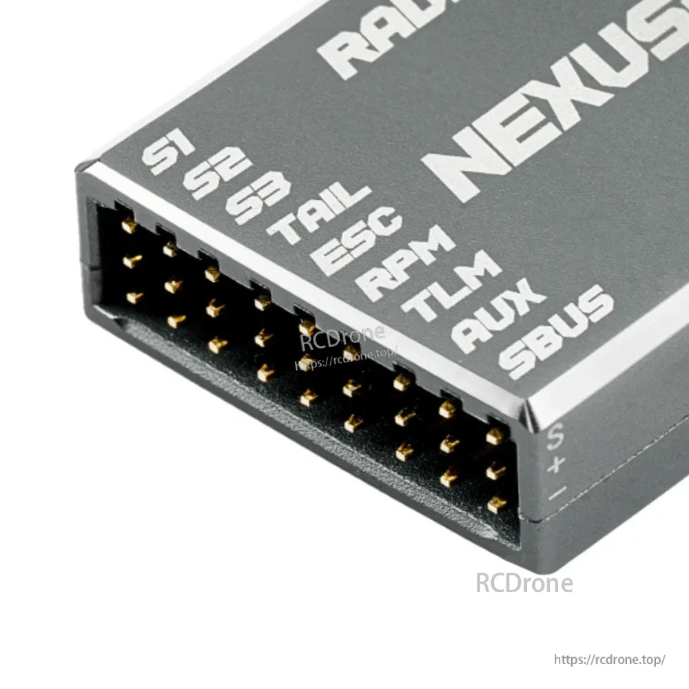 Close-up of NEXUS-X multi-pin header labeled S1 S2 S3 TRL ESC RPM TLM AUX SBUS