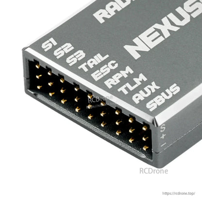 Close-up of NEXUS-X multi-pin header labeled S1 S2 S3 TRL ESC RPM TLM AUX SBUS