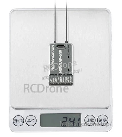 RadioMaster NEXUS-XR on digital scale displaying 24.1g weight with two antennas attached