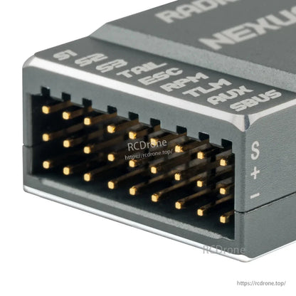 Close-up of NEXUS-XR multi-pin header connector with labeled pins (S1–S3, THR, AIL, AUX, SBUS)
