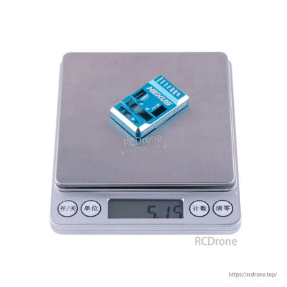 Blue Nexus aluminum case on digital scale with display reading 5.19