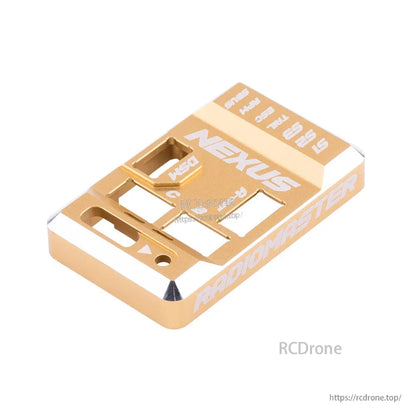 Angled view of gold aluminum Nexus case showing machined edges and Radiomaster side engraving