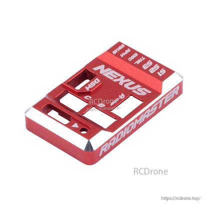 Angled view of red aluminum Nexus case showing machined edges and Radiomaster side engraving