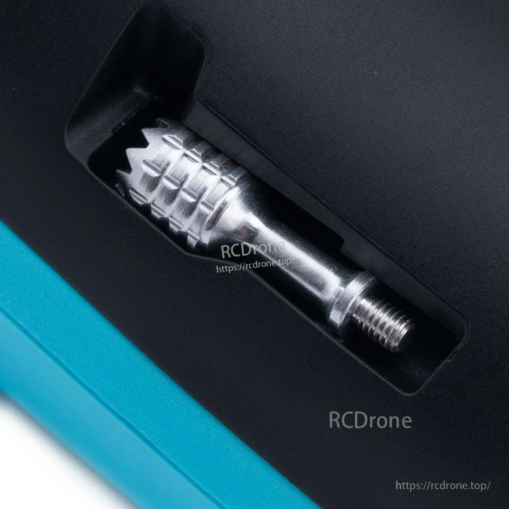 Rear storage slot close-up showing a metal gimbal stick stored inside the RadioMaster Pocket Crush transmitter
