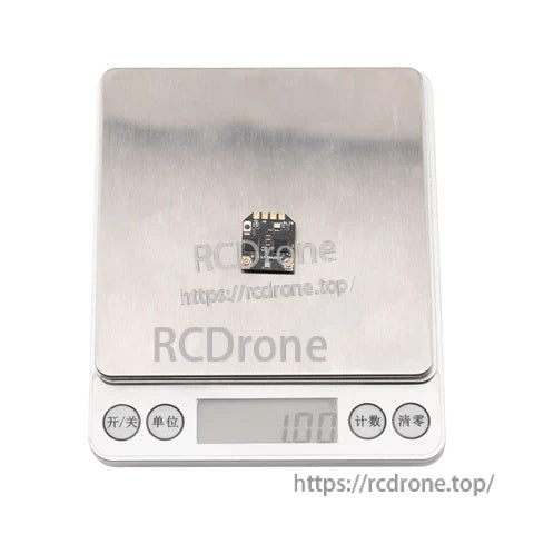 RP4TD-M receiver on a digital scale reading 1.00g, showing the lightweight mini receiver body without antennas
