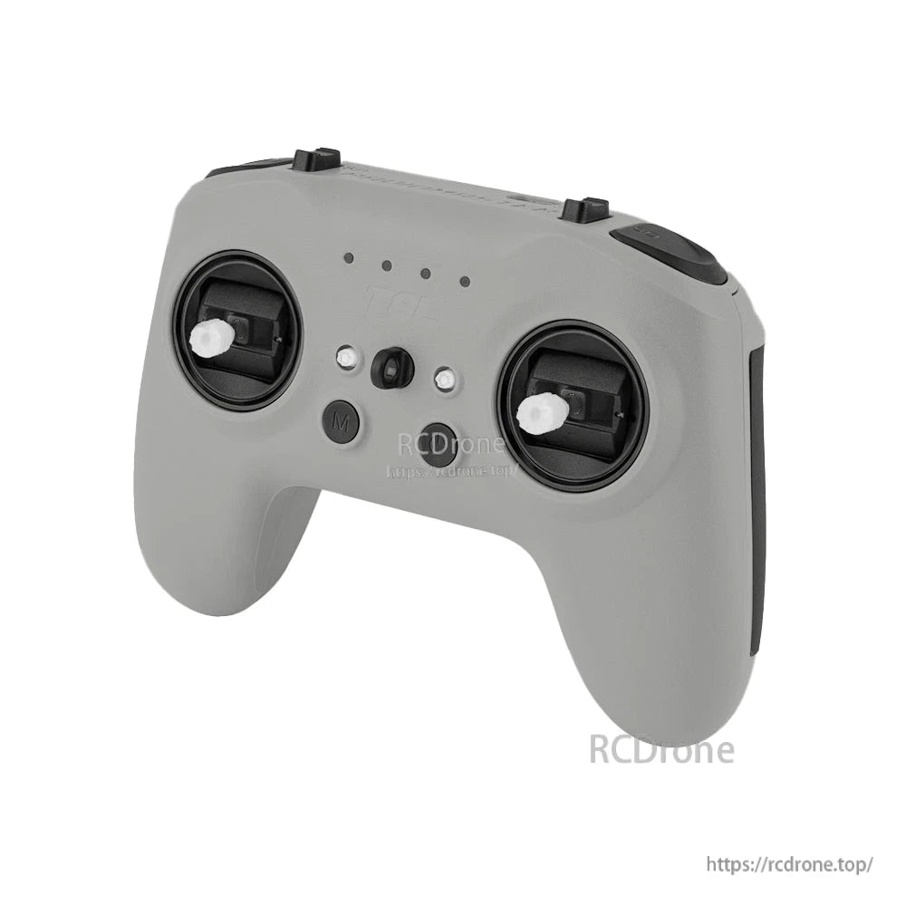Angled front perspective of T8L gray controller showing gimbals, top switches, and rounded grip shape