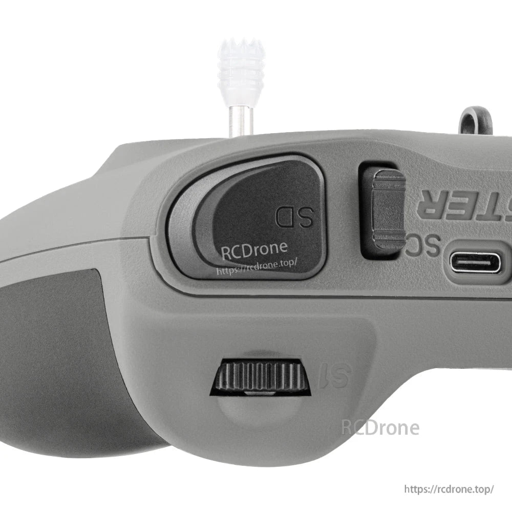 Close-up of top shoulder area showing SD label, power switch, USB-C port, and scroll wheel control