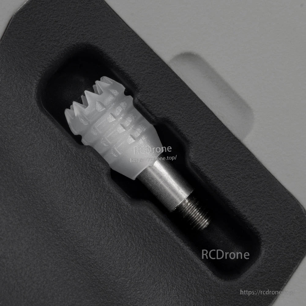 Rear grip close-up showing gimbal stick recess and threaded metal stick end on the controller
