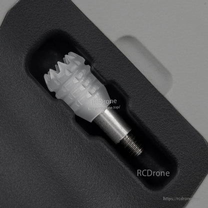 Rear grip close-up showing gimbal stick recess and threaded metal stick end on the controller