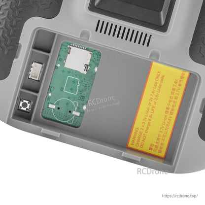 TX15 battery compartment view showing internal module area, connector and Li-ion warning label