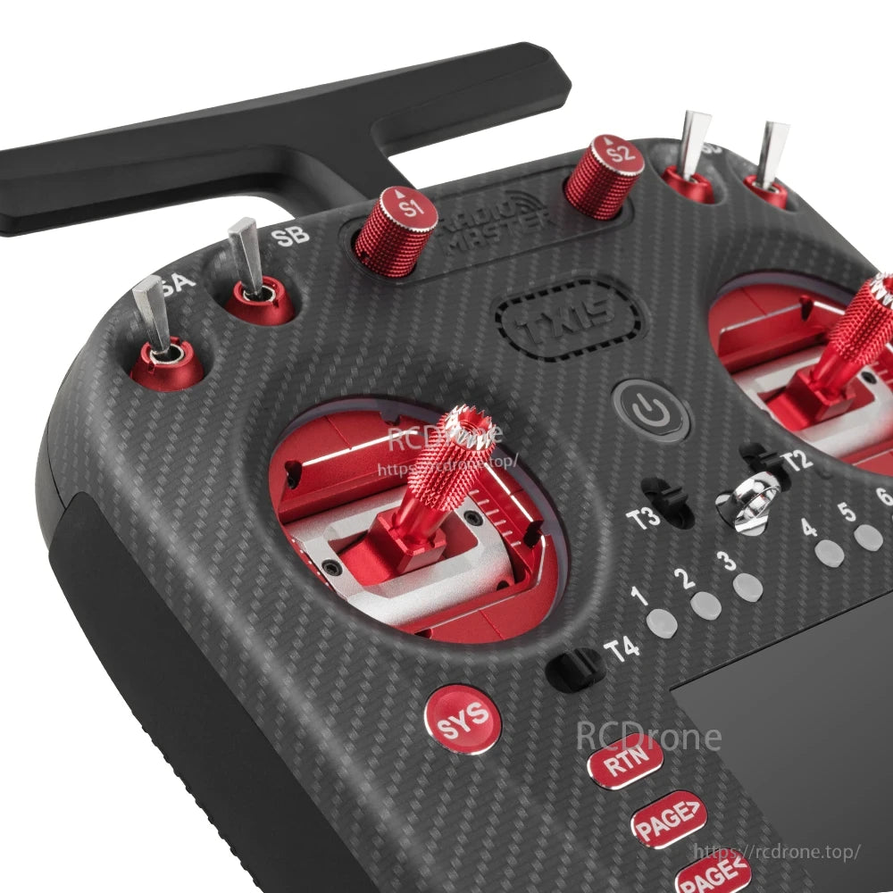 Close-up of TX15 Max top switches and metal gimbal sticks with red anodized adjustment knobs