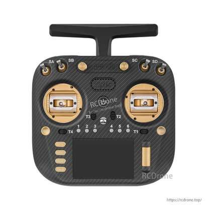 TX15 Max transmitter front view with gold gimbals and switches, carbon-fiber style faceplate