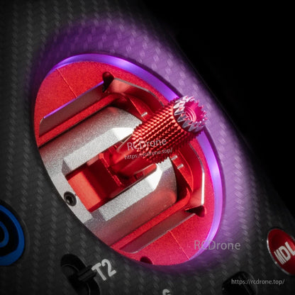 AG02 gimbal with LED ring lit purple and red, angled close-up on transmitter faceplate