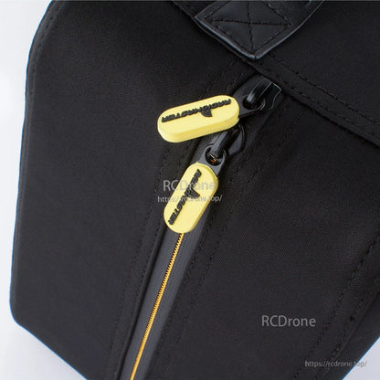 Close-up of zipper and yellow RadioMaster zipper pulls on black case fabric