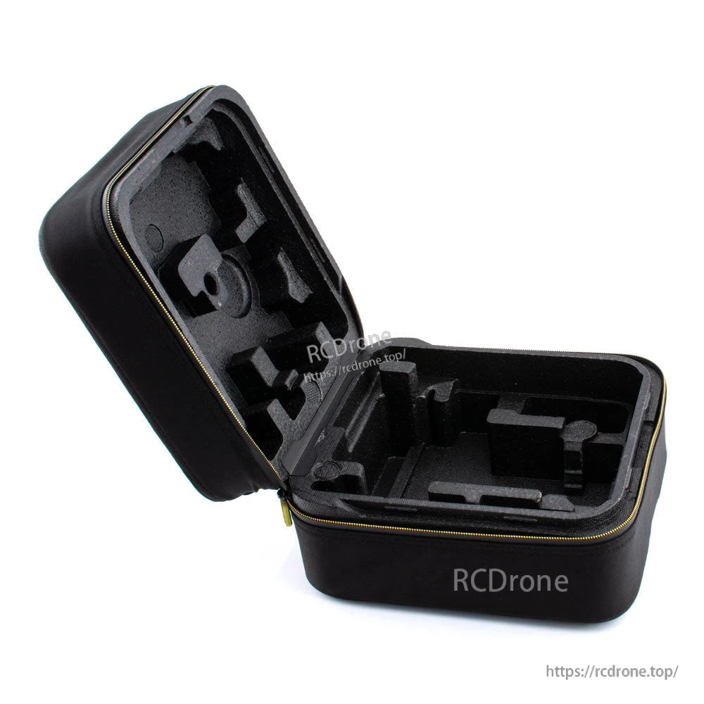 Open case interior with custom-cut foam compartments for RC transmitter storage