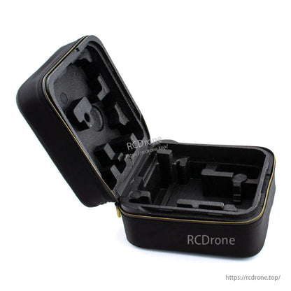 Open case interior with custom-cut foam compartments for RC transmitter storage
