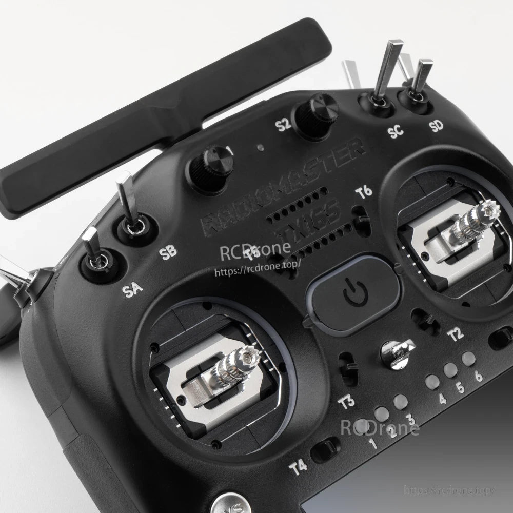 Close-up of top controls: antenna mount area, S1/S2 knobs, switches and gimbal tops