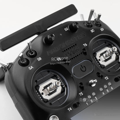 Close-up of top controls: antenna mount area, S1/S2 knobs, switches and gimbal tops