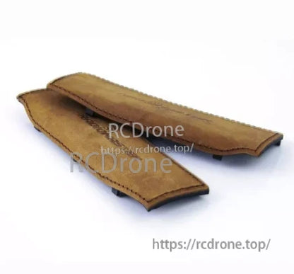 Tan leather-look side grip pair for TX16S MKII transmitter, angled view showing mounting clips