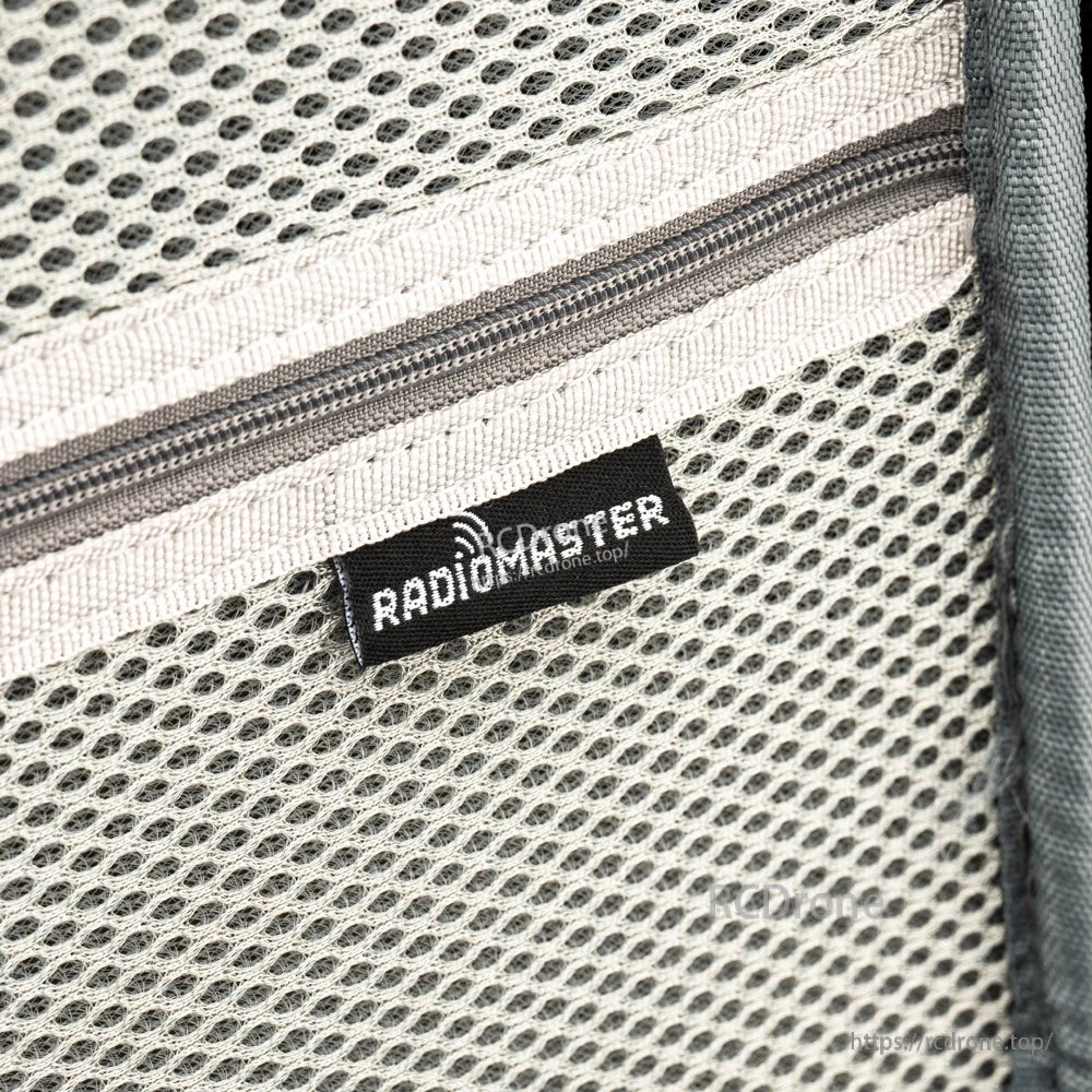 Close-up of interior mesh pocket zipper and RadioMaster label tag inside the case lid