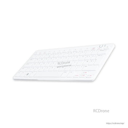 White keyboard with red function keys and minimalist design