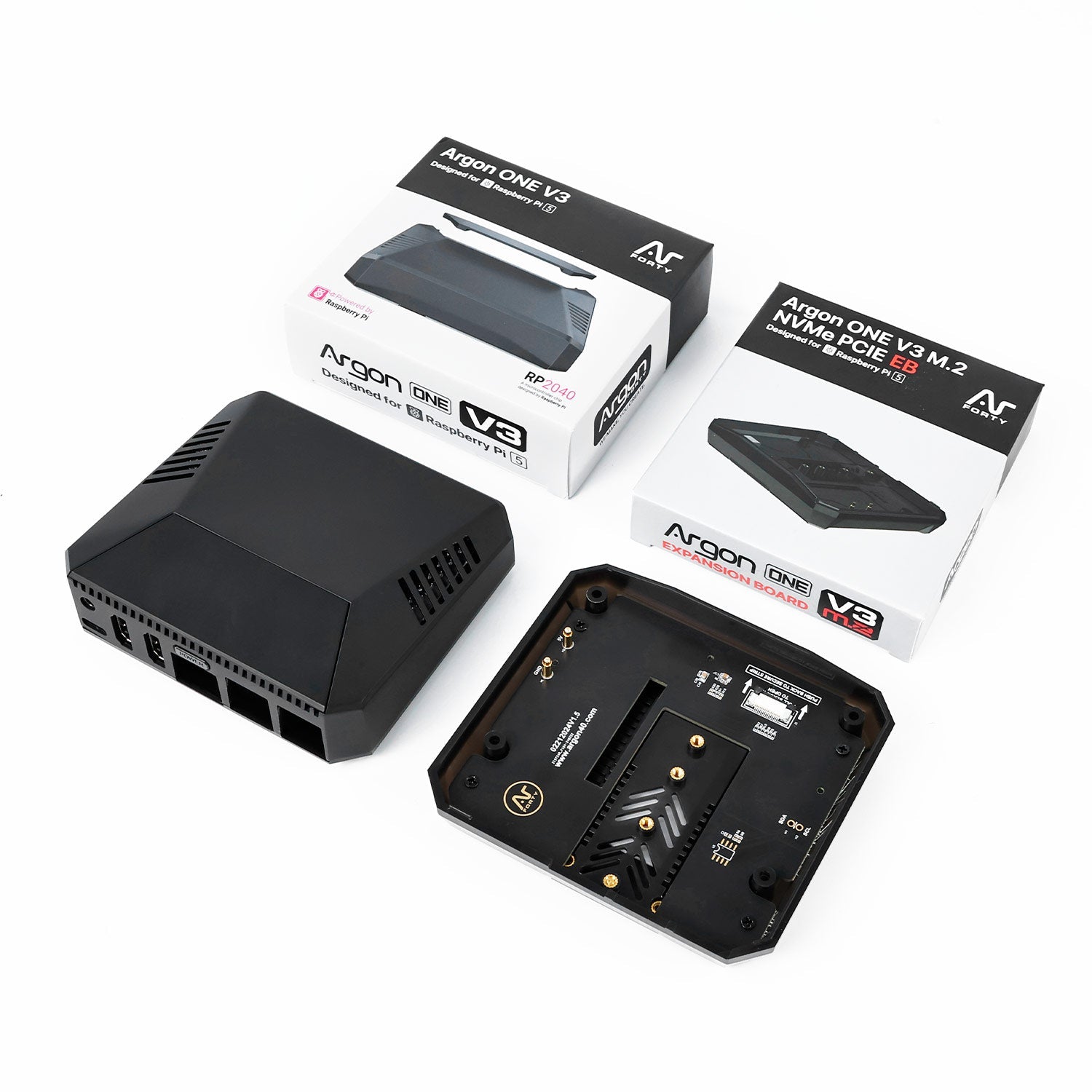 Argon ONE V3 case kit laid out with retail boxes, top cover, and base plate for assembly