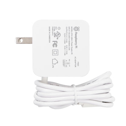 Official Raspberry Pi 27W USB-C power adapter label view with US plug and attached cable