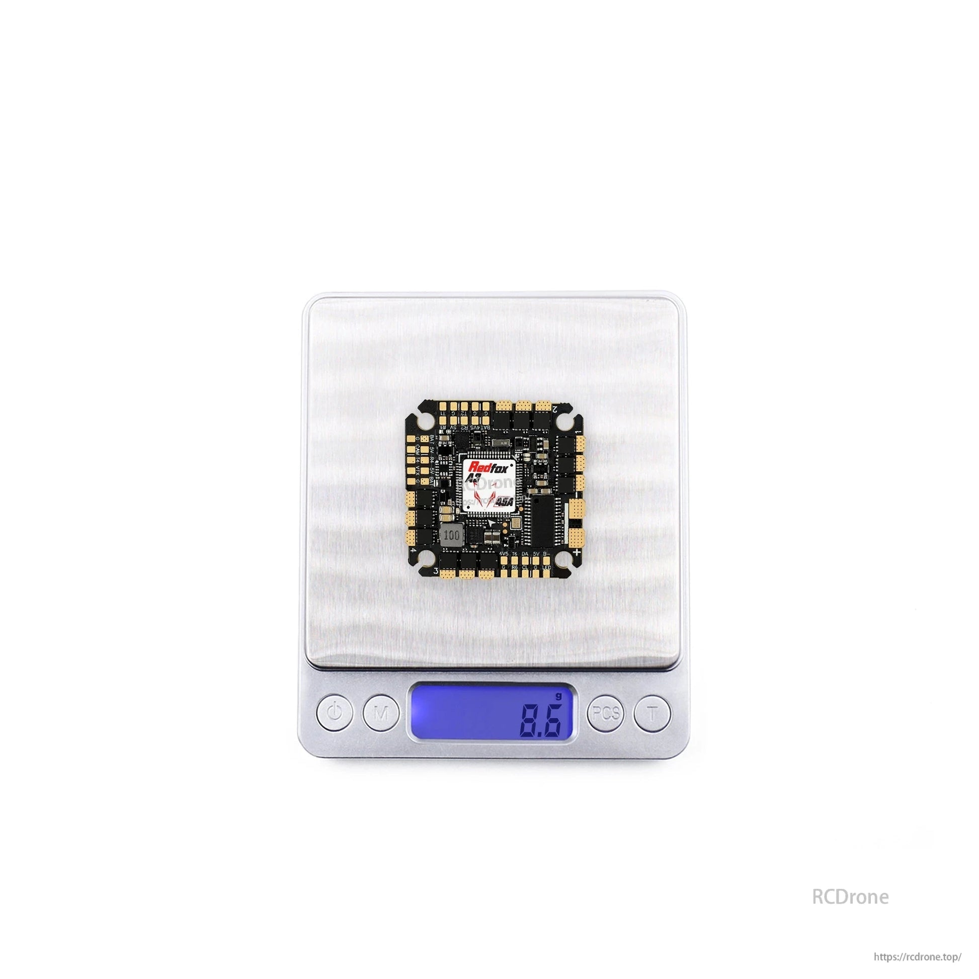 Digital scale photo showing the board centered on platform with 8.9 g displayed