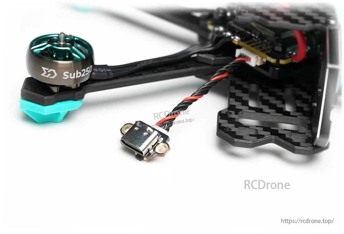 USB Type-C adapter board installed on FPV drone frame near motor and flight stack