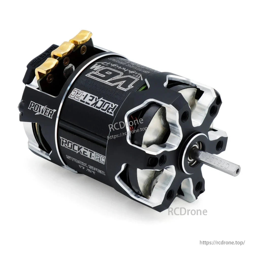 Angled shaft-end view of black and silver motor housing with exposed cooling openings