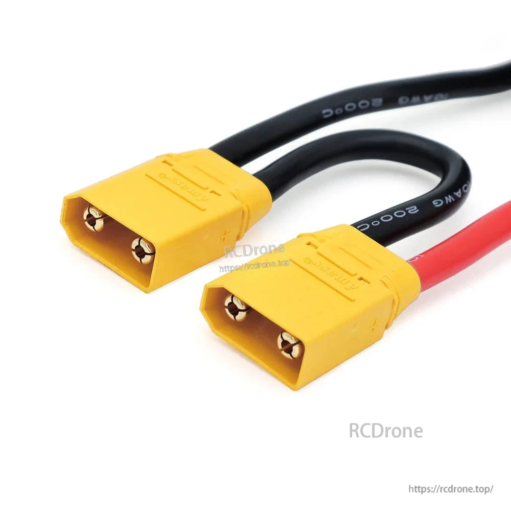 Close-up of yellow high-current power connectors on red and black ESC battery leads