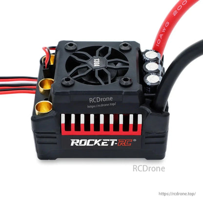 Brushless ESC side view with 130A cooling fan, capacitors and red heat-sink accent