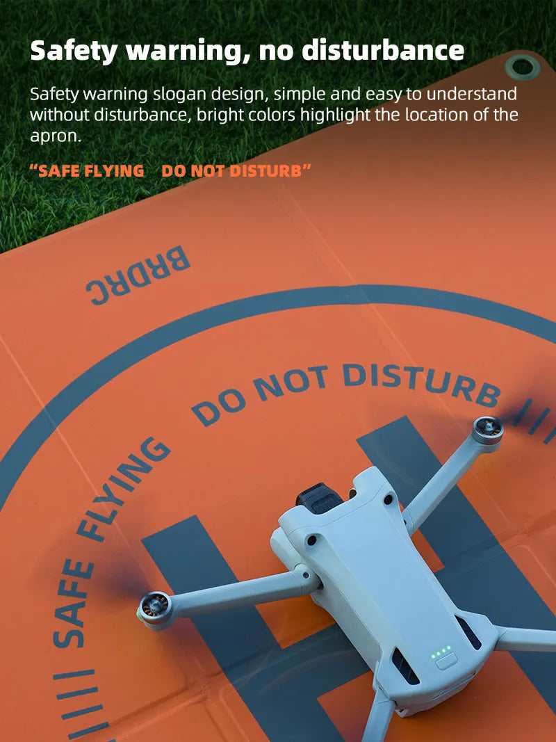 Foldable Landing Pad for DJI Mavic 3 AIR 2/2S/2/3/Holy Stone/SJRC Drone Parking Apron Pad Mat Drone Accessories 65CM*65CM 11 safety warning slogan design . bright colors highlight the location of the apron .