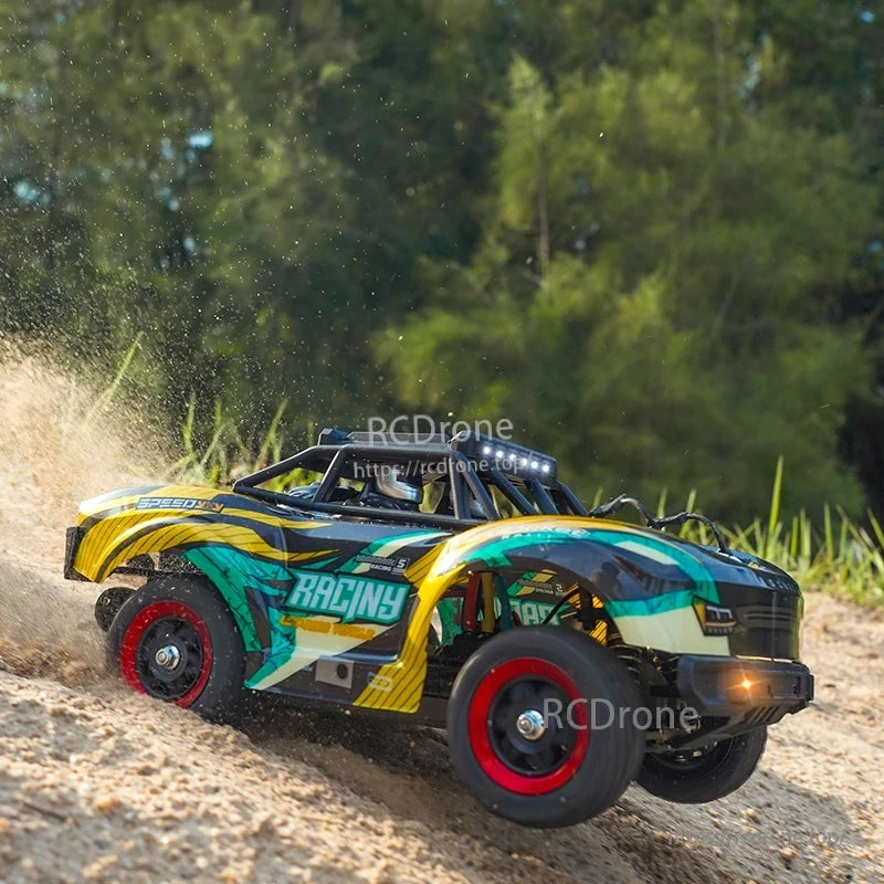 SCY 18103 PRO 1/18 RC Car, A vehicle drivetrain features a four-wheel-drive system with metal components including a planetary differential, dog bones, wheel cups, and a central drive shaft.