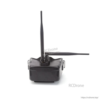 FPV goggles with two whip antennas attached at the top receiver ports, front view