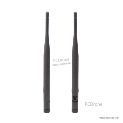 Pair of 1.2G whip antennas standing upright, showing base and side cutout detail