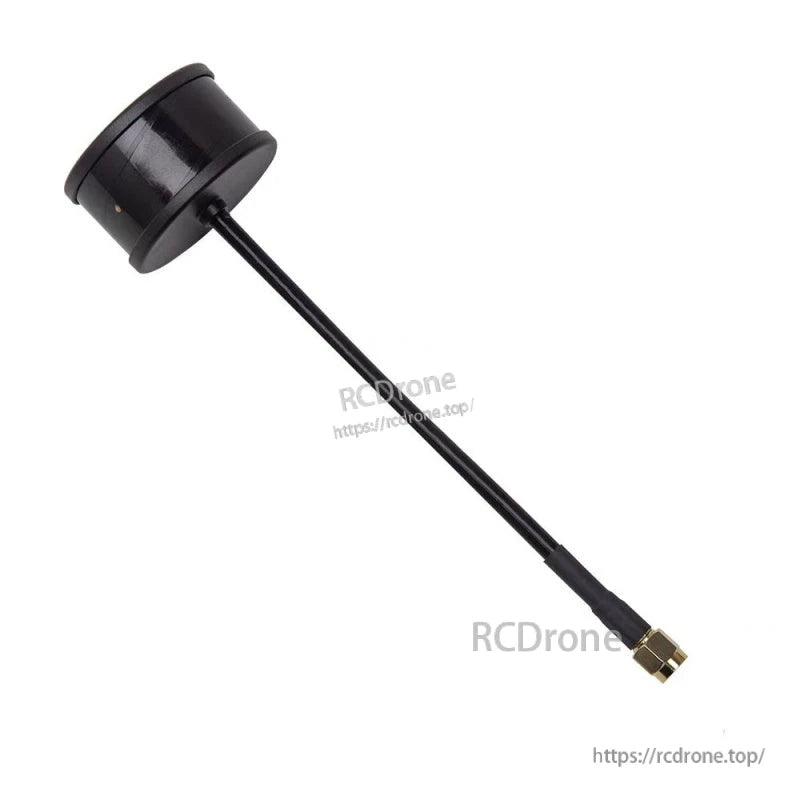 Angled view of black puck FPV antenna with long coax lead and gold SMA connector tip