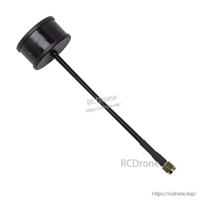 Angled view of black puck FPV antenna with long coax lead and gold SMA connector tip