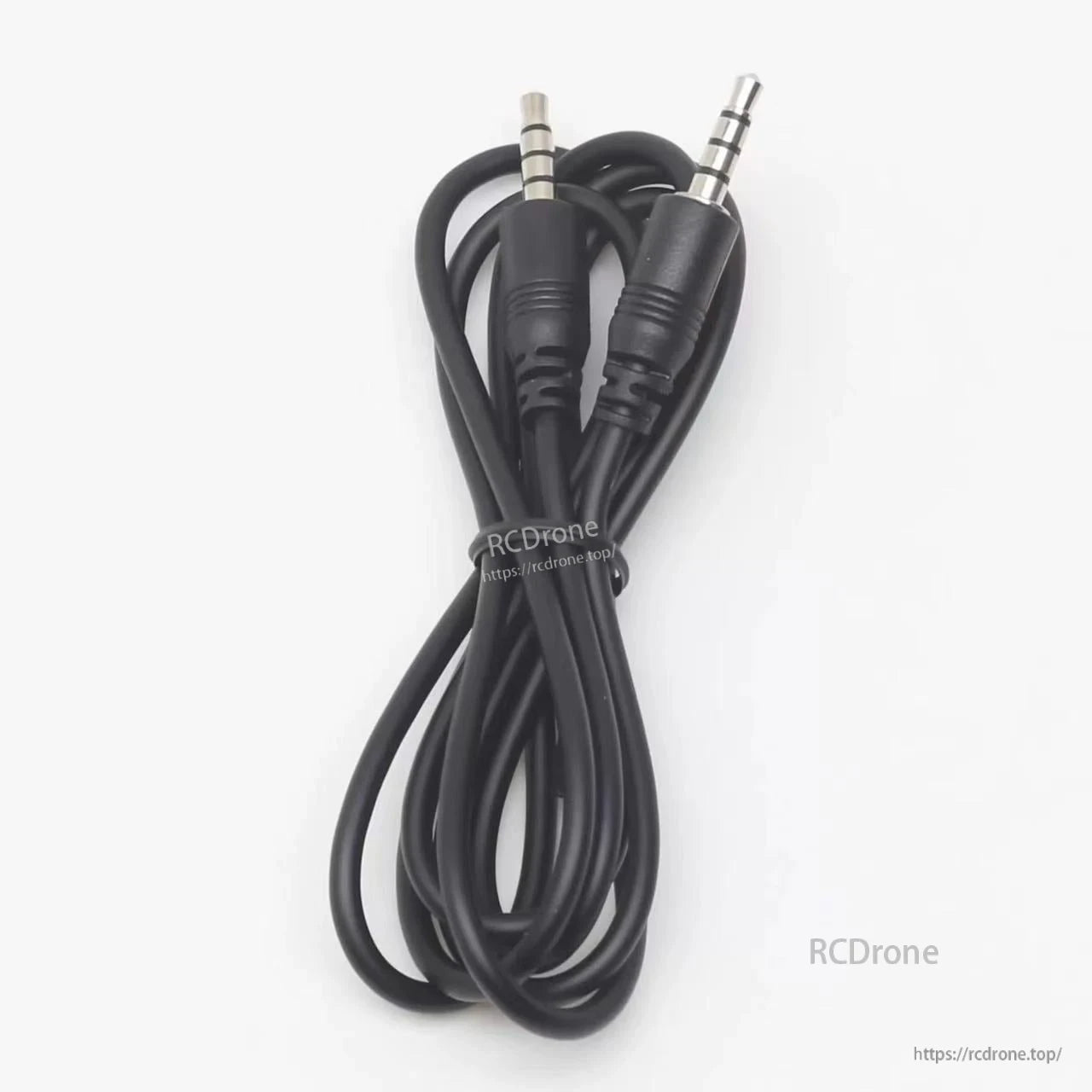 Close view of black head tracking cable with two 3.5mm 4-pole male connectors on white background