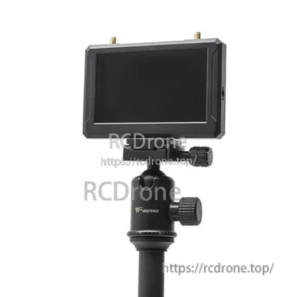 SKYZONE M5 5-inch LCD screen mounted on a tripod ball head, showing viewing setup and dual antenna connectors