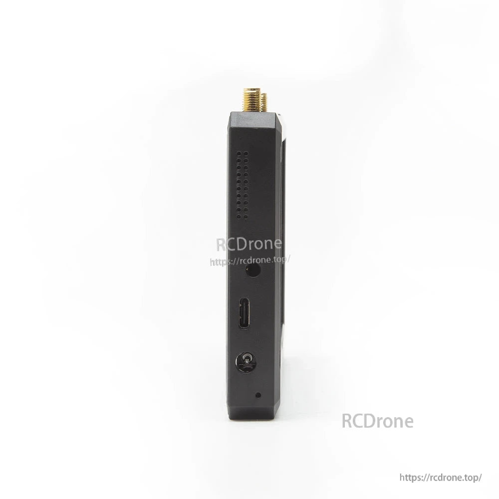 Side view showing USB Type-C port, DC power jack, and ventilation holes on the monitor body