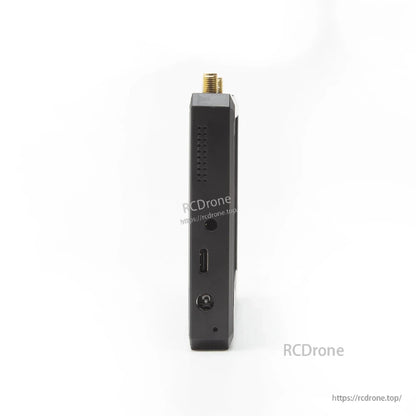 Side profile showing vent holes and ports including USB‑C and DC power input