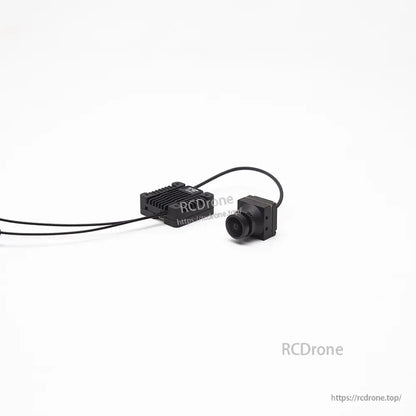 Camera close-up with lens and mounting bracket, wired to finned VTX module in the rear