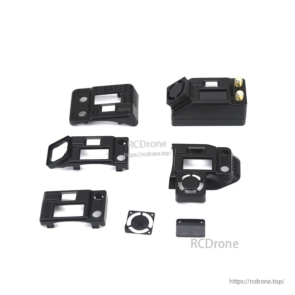 Receiver module set with multiple adapter housings and mounting pieces laid out beside the module