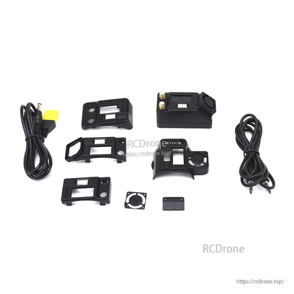 Accessory layout with receiver, multiple faceplate shells, mounting parts and power/AV cables on white background
